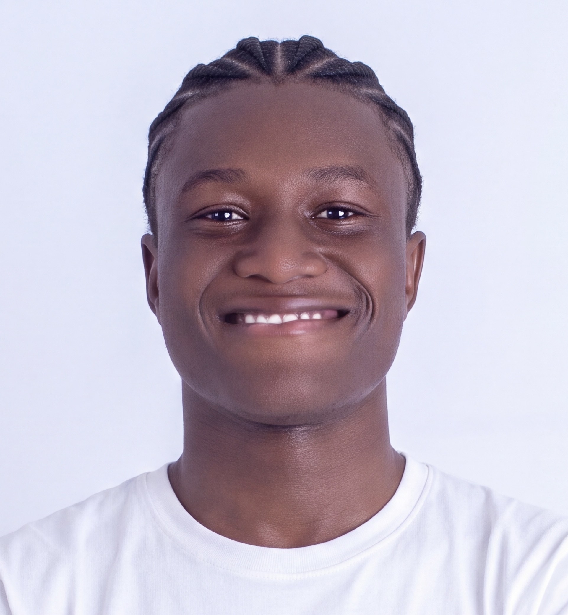 Kanmi David smiling, wearing a white tee
